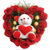 Christmas Gifts to Mumbai that is 18 Red Roses with 5 Ferrero Rocher Chocolates in Mumbai and Teddy Heart.