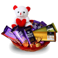 Send Special friend Gifts of Dairy Milk, Silk, Temptation Chocolates and 6 Inch Teddy Basket to Mumbai  