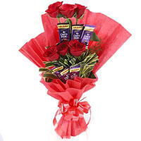 Place order to send 16 Pcs Ferrero Rocher and 24 Red White Roses Bouquet Mumbai