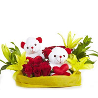 Onlie Gifts to Mumbai. 2 Yellow Lily 12 Red Roses 2 Small Teddy Basket