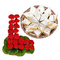 Deliver New Year Gifts with Sweets to Mumbai along with 24 Red Carnation Basket with 1/2 Kg Kaju Burfi