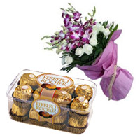 Send New Year Gifts in Mumbai with 8 Orchids 12 White Rose Bouquet 16 Pcs Ferrero Rocher Chocolate in Mumbai