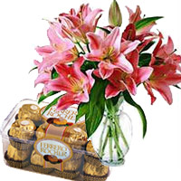 Online New Year Gifts Delivery in Mumbai that includes 15 Pink Lily Vase, 16 Pcs Ferrero Rocher Chocolate in Mumbai