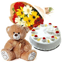 Christmas Gifts to Mumbai Same Day including  12 Gerbera Bouquet with 1 Kg Pineapple Cake in Pune and 1 Teddy Bear