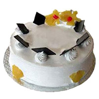 Cake Delivery in Mumbai to send 1 Kg Eggless Pineapple Cake From 5 Star Bakery