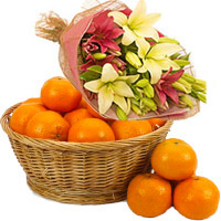 Deliver Friendship Day Gift of Pink Yellow Lily Bouquet 4 Flower Stems with 18 pcs Fresh Orange Fruit on Friendship Day