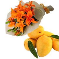 Get Christmas Gifts to Mumbai incorporated Orange Lily Bouquet 4 Flower Stems and 12 pcs Fresh Mango