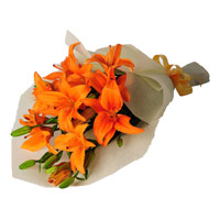 Place Online Order for New Year Flowers in Mumbai. Orange Lily Bouquet 4 Flower in Mumbai