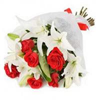 Christmas Flowers Delivery in Mumbai along with 3 White Lily 9 Red Roses Bouquet