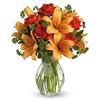 Buy Orange Lily Red Roses in Vase 12 Flowers in Mumbai. Christmas Flowers to Vashi