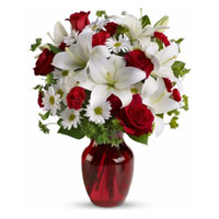 Best Christmas Flowers Delivery in Mumbai Deliver to 2 White Lily 6 White Gerbera 6 Red Roses Vase in Mumbai