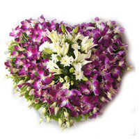 Luxuriest New Year Flowers Delivery in Mumbai delivers 3 White Lily 15 Orchids Heart Arrangement Flowers in Mumbai