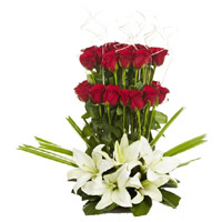 Friendship Day flower arrangement of 3 White Lily 30 Red Rose Flower Arrangement to Mumbai