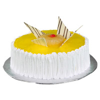 Online Order for Best New Year Cakes in Mumbai encircle with 1 Kg Pineapple Cake in Mumbai From 5 Star Bakery