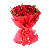 New Year Flowers to Ahmednagar comprising Red Rose Bouquet in Crepe 24 Flowers to Mumbai