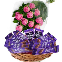 Diwali Gifts to Mumbai with Dairy Milk Basket 12 Chocolates in Mumbai With 12 Pink Roses in Akola