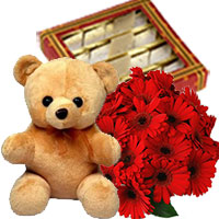 Buy Ganesh Chaturthi Gifts in Mumbai to Send 12 Gerbera Bouquet with 1/2 Kg Kaju Burfi and 1 Teddy Bear