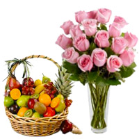 Send Christmas Fresh fruits in Mumbai along with 12 Pink Roses in Vase with 1 Kg Fresh Fruits Basket in Mumbai