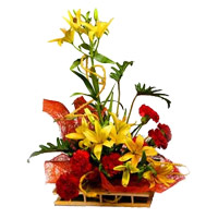 New Year Flowers Delivery in Mumbai add up to 6 Yellow Lily 6 Red Carnation Arrangement of Flowers to Mumbai