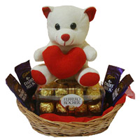 Online Gift Delivery in Mumbai. 4 Dairy Milk 16 Ferrero Rocher Chocolates and 6 Inch Teddy Basket