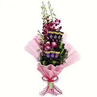 Send Online New Year Gifts Mumbai that includes 12 Red Roses 5 Ferrero Rocher Bouquet
