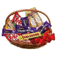 Christmas Gifts Delivery in Mumbai Basket of Assorted Chocolates in Panvel with 10 Red Roses to Nashik