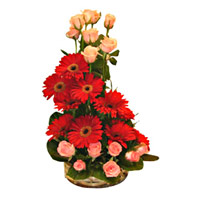 Deliver Online Durga Puja Flowers to Mumbai comprising of Red Gerbera Pink Roses Basket 24 Flowers