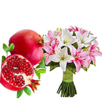 New Year Gifts to Mumbai additionally of 1 Kg Fresh Promegranate with Pink White Lily Bouquet 6 Stems