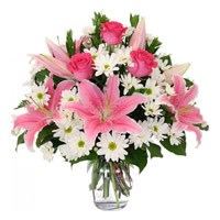 Buy Christmas Flowers to Mumbai including 2 White Lily 6 Pink Rose 10 White Gerbera Vase.