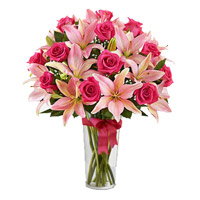 Order Online Diwali Flowers to Mumbai consist of 4 Pink Lily 15 Pink Rose Vase