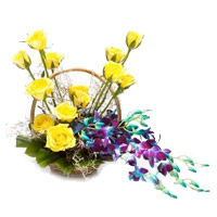 Send 6 Orchids and 12 Roses Arrangement of Rakhi Flowers to Mumbai