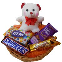 Deliver Christmas Gifts in Mumbai constuting  6 Inches Teddy with Basket of Chocolates to Mumbai