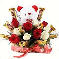 Send Christmas Gifts to Ahmednagar along with 36 Red White Roses with 16 Pcs Ferrero Rocher Bouquet in Akola